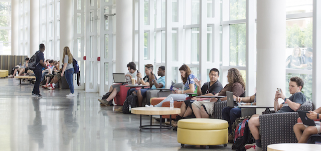 studetns sitting in atrium