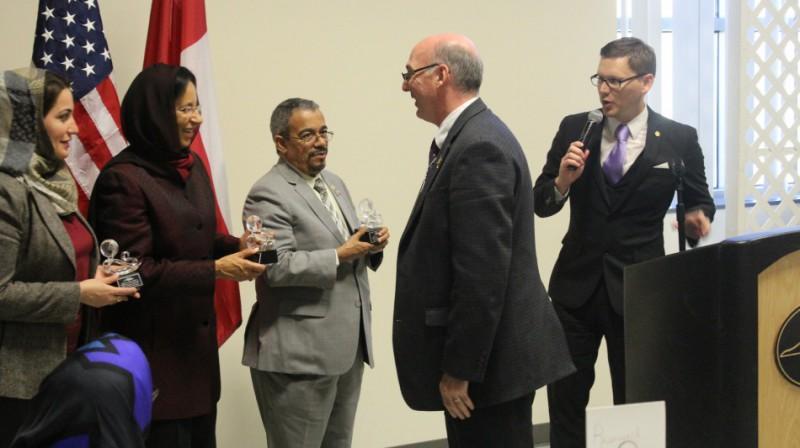  / Dr. Askildson and Dr. Paracka present tokens of appreciation to honored members of the Omani delegation. From right to left: Dr. Mona bint Fahad Al Said, Assistant Vice Chancellor, Sultan Qaboos University, Omani Ambassador to the U.S. Hunaina Al Mughairy, and Dr. Ali Al Bimani, Vice chancellor of Sultan Qaboos University.