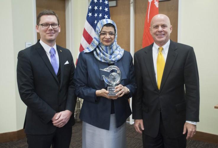  / Dr. Lance Askildson and Dr. Ken Harmon present a gift to Omani Minister of Higher Education Dr. Rawya Saud Al Busaidi.