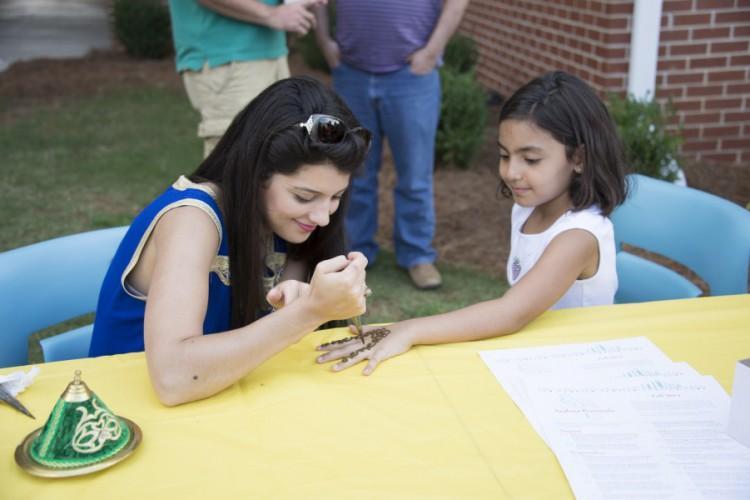  / The henna hand painting was a popular attraction with the festival's youngest guests.