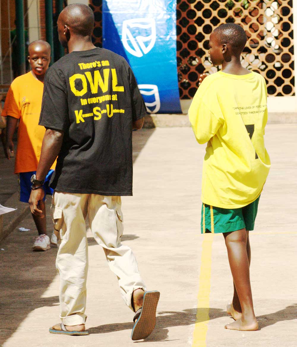 young africans walking with ksu shirts