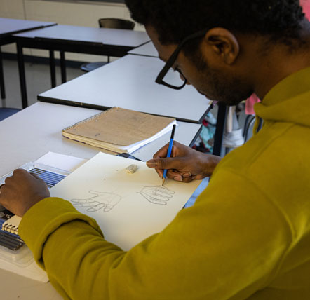 student preparing drawing for cas competition 