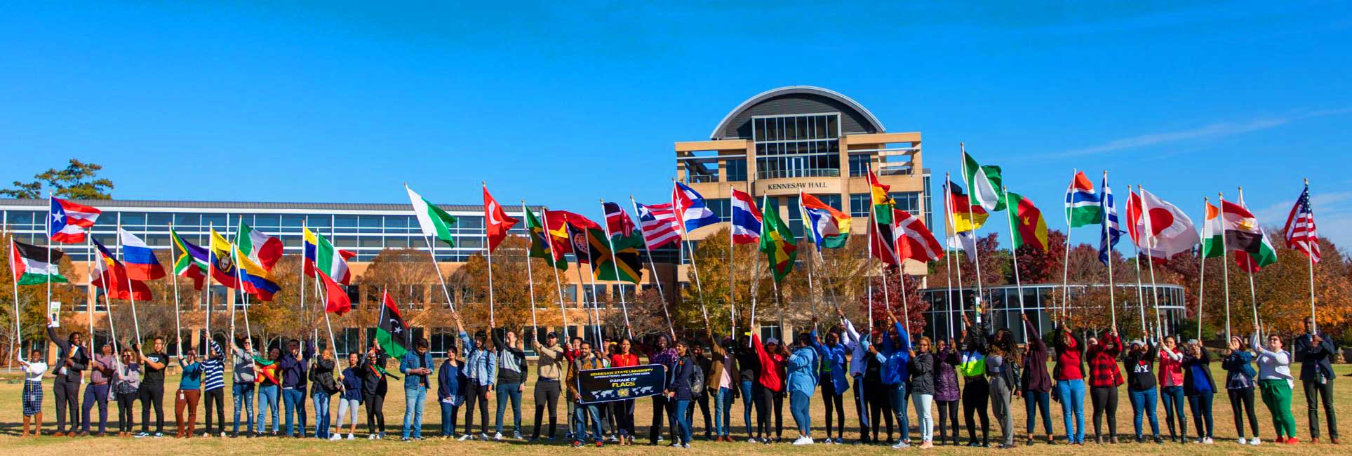 Students holding International Flags at Kennesaw State Celebrating International Education Week