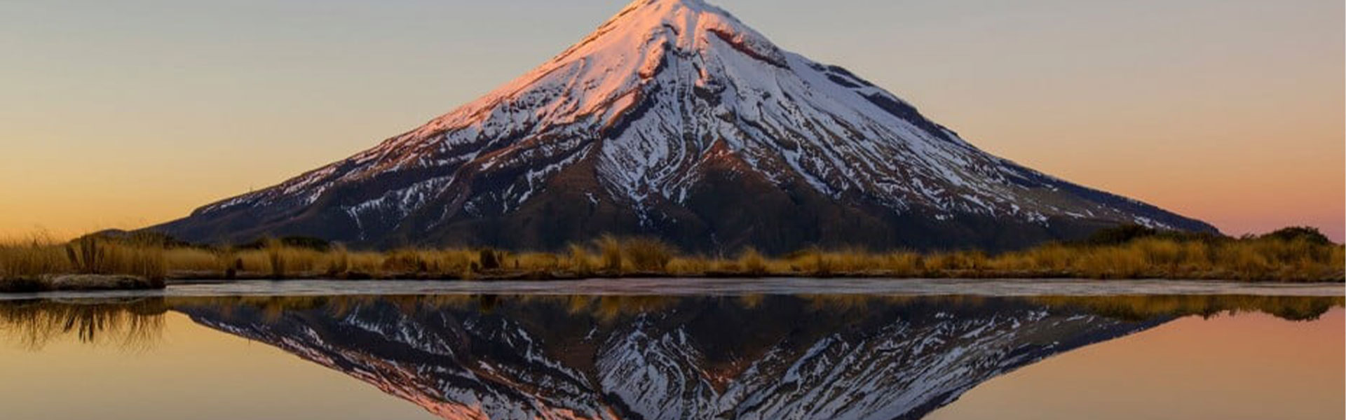 Mt. Taranaki in New Zealand and its reflection over the water