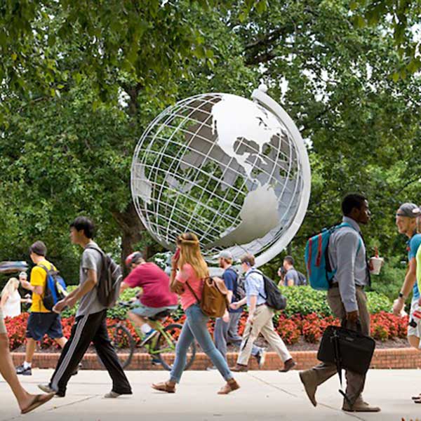 ksu students walking through courtyard on campus