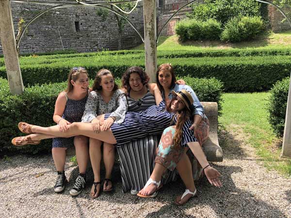 photo of KSU students in Italy outside on a bench