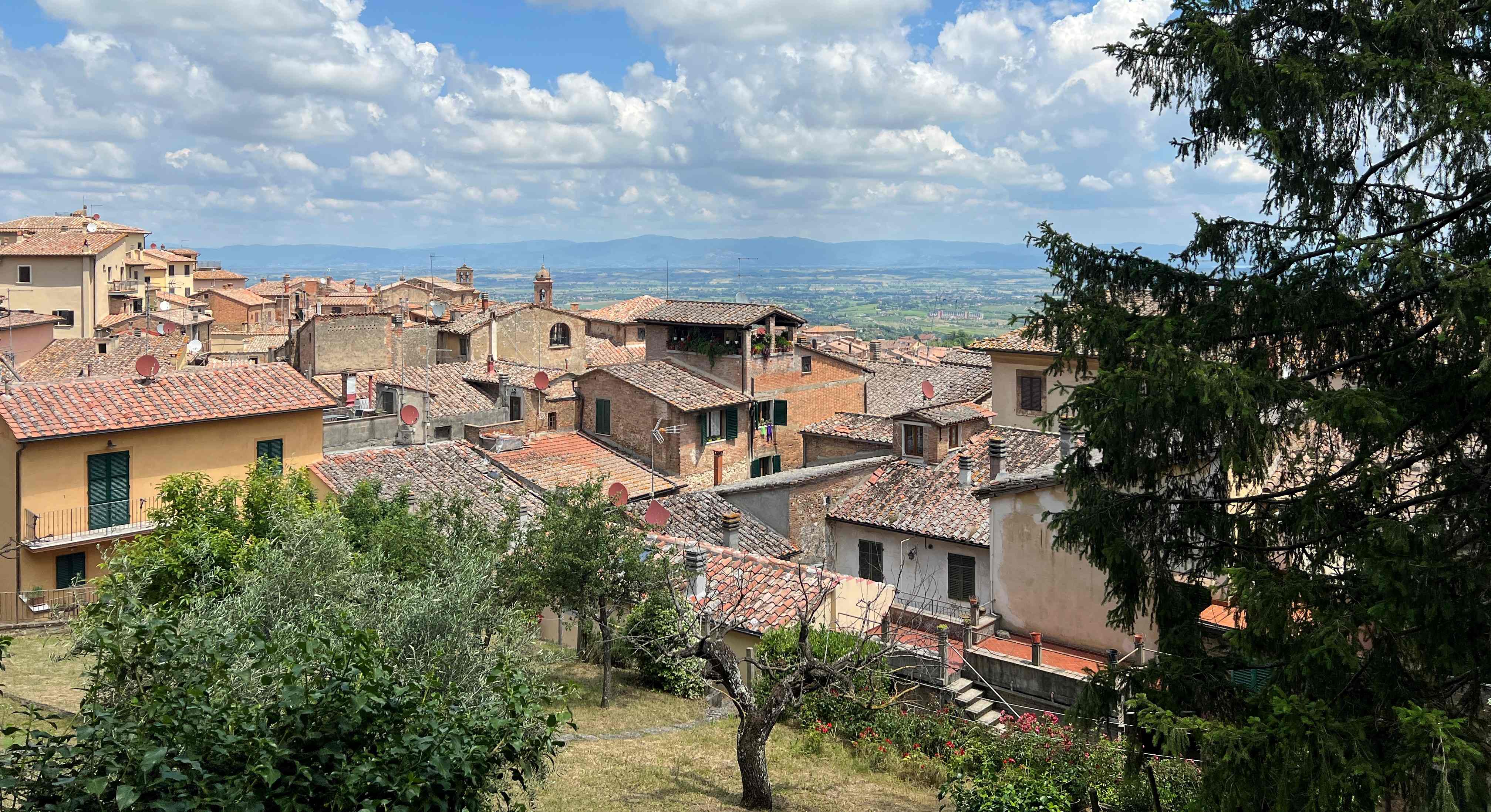 photo of people on a square in montepulciano italy