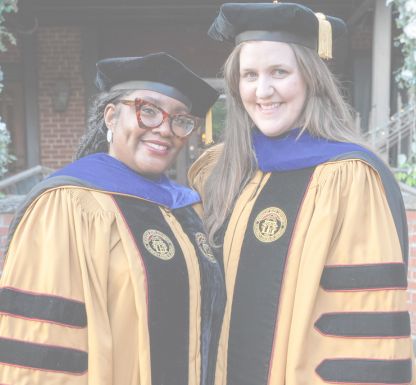 A man smiling warmly at the camera.