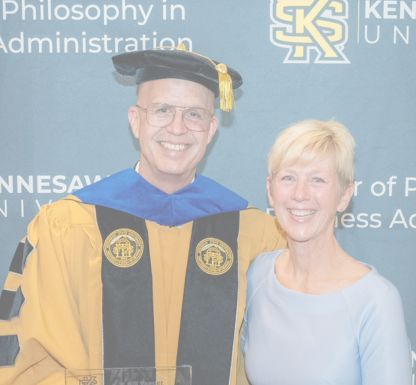A woman with long hair looking cheerful and relaxed.