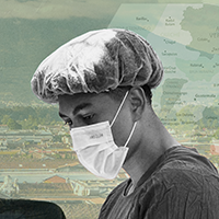 Male student in mask and scrubs works in a medical setting in Guatemala.