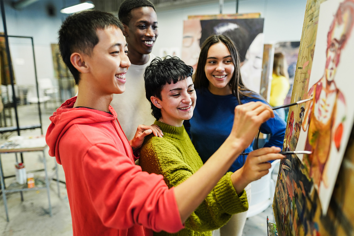 male student working robotics equipment