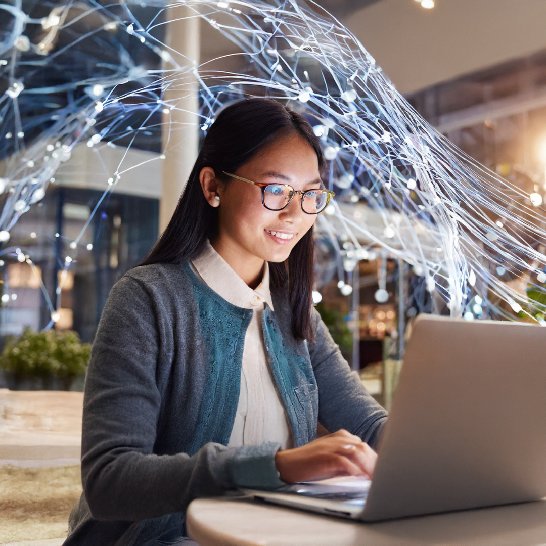 female with glasses and blonde hair smiling