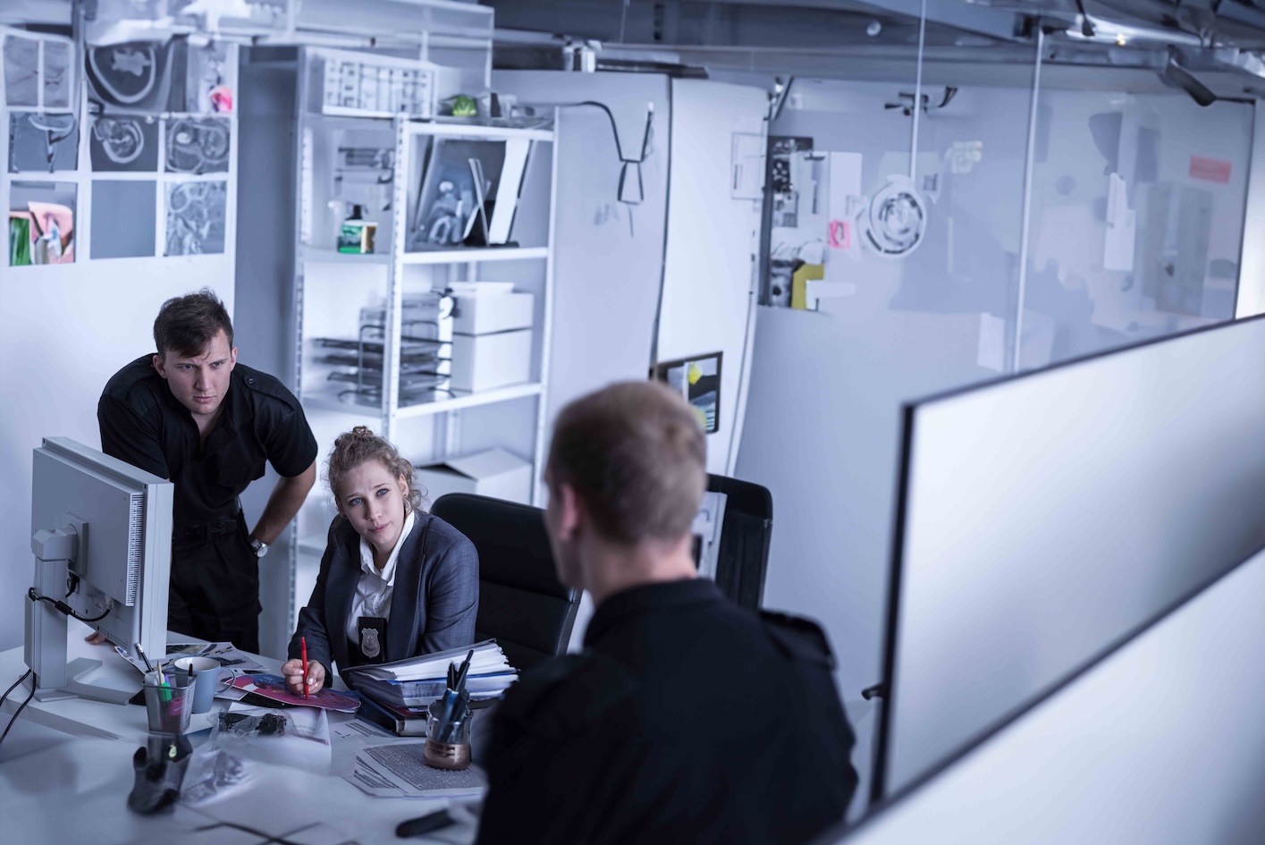 group of people at round table talking about criminal justice cases