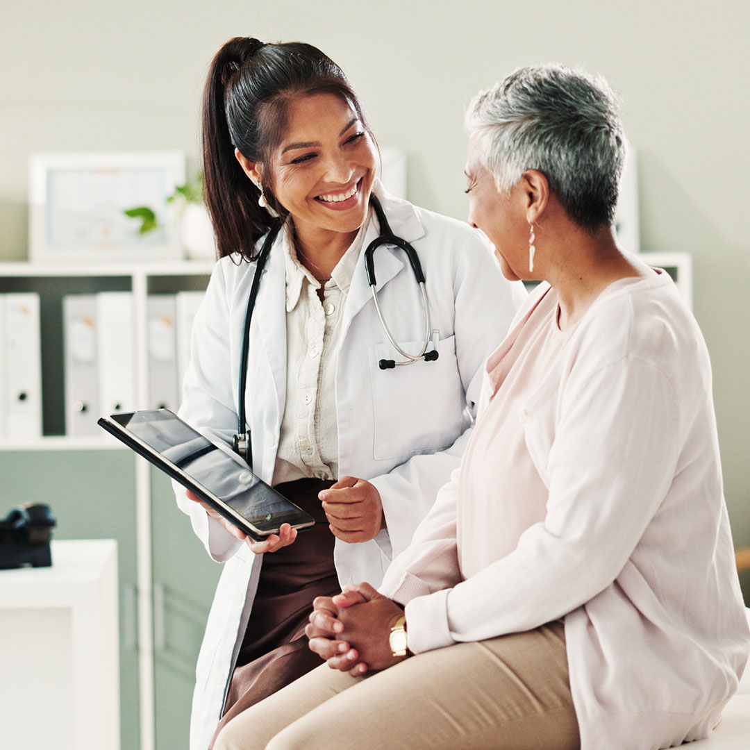 Healthcare provider performing a routine ear examination for a pediatric patient in a clinical setting.