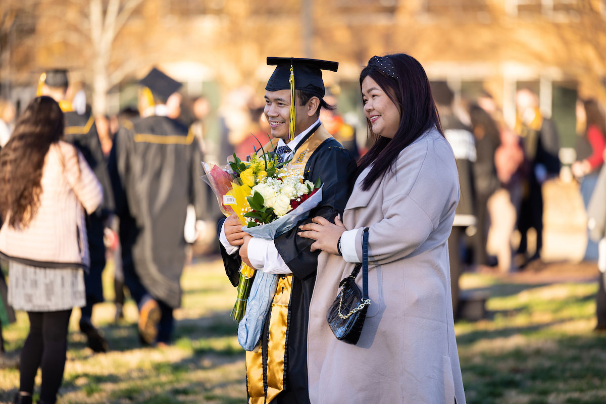 family attending KSU commencement ceremony