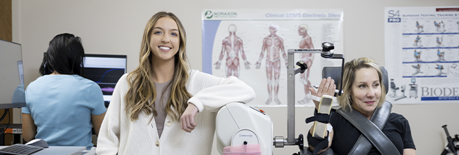 female student with test patient using exercise science equipment