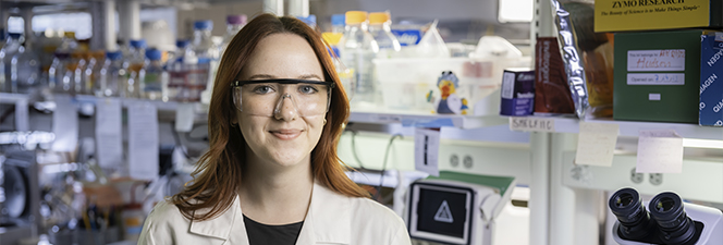 ksu female chemistry student smiling in lab