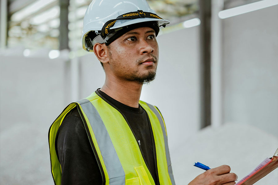 construction managemer taking notes on site