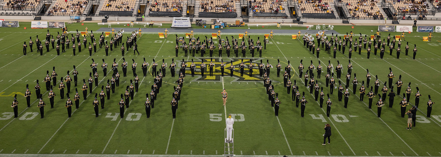 "The Marching Owls" performing during a football game