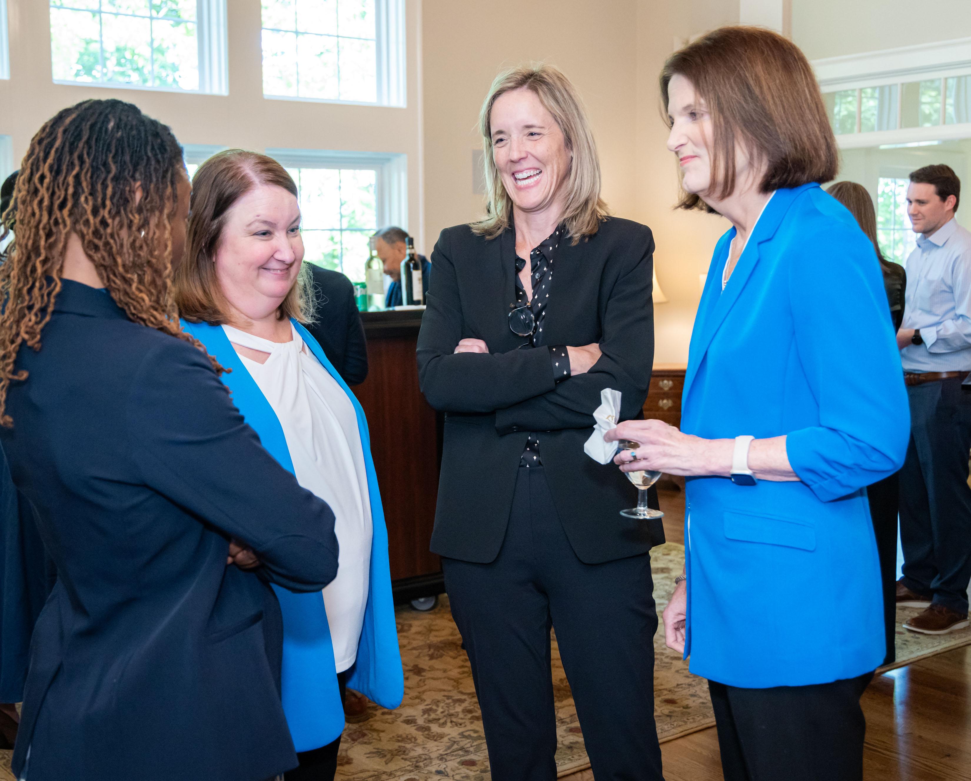  / president, kathy schwaig speaking with guests