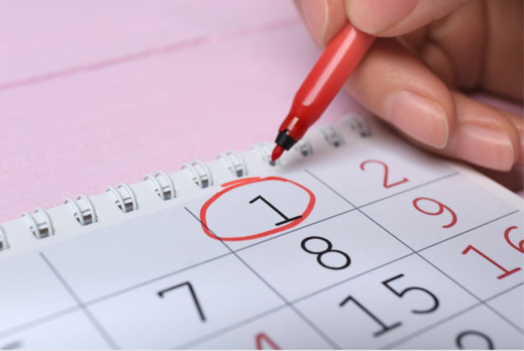 A red pen circling the first day on a calendar