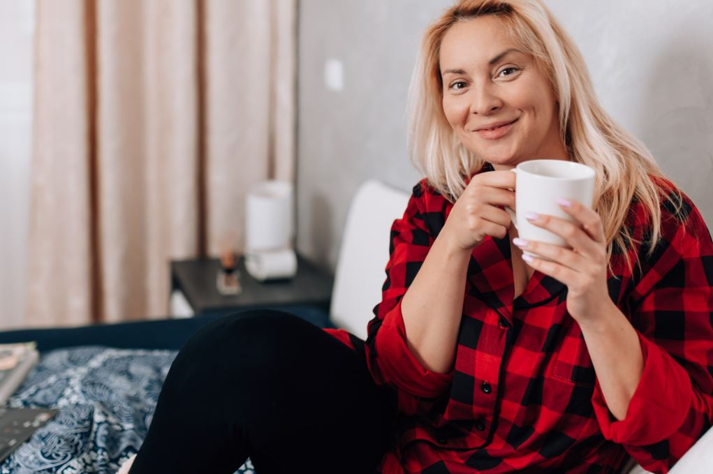 Woman with the flu drinking