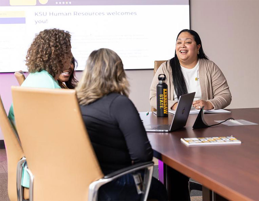 Group of HR employees at a meeting.