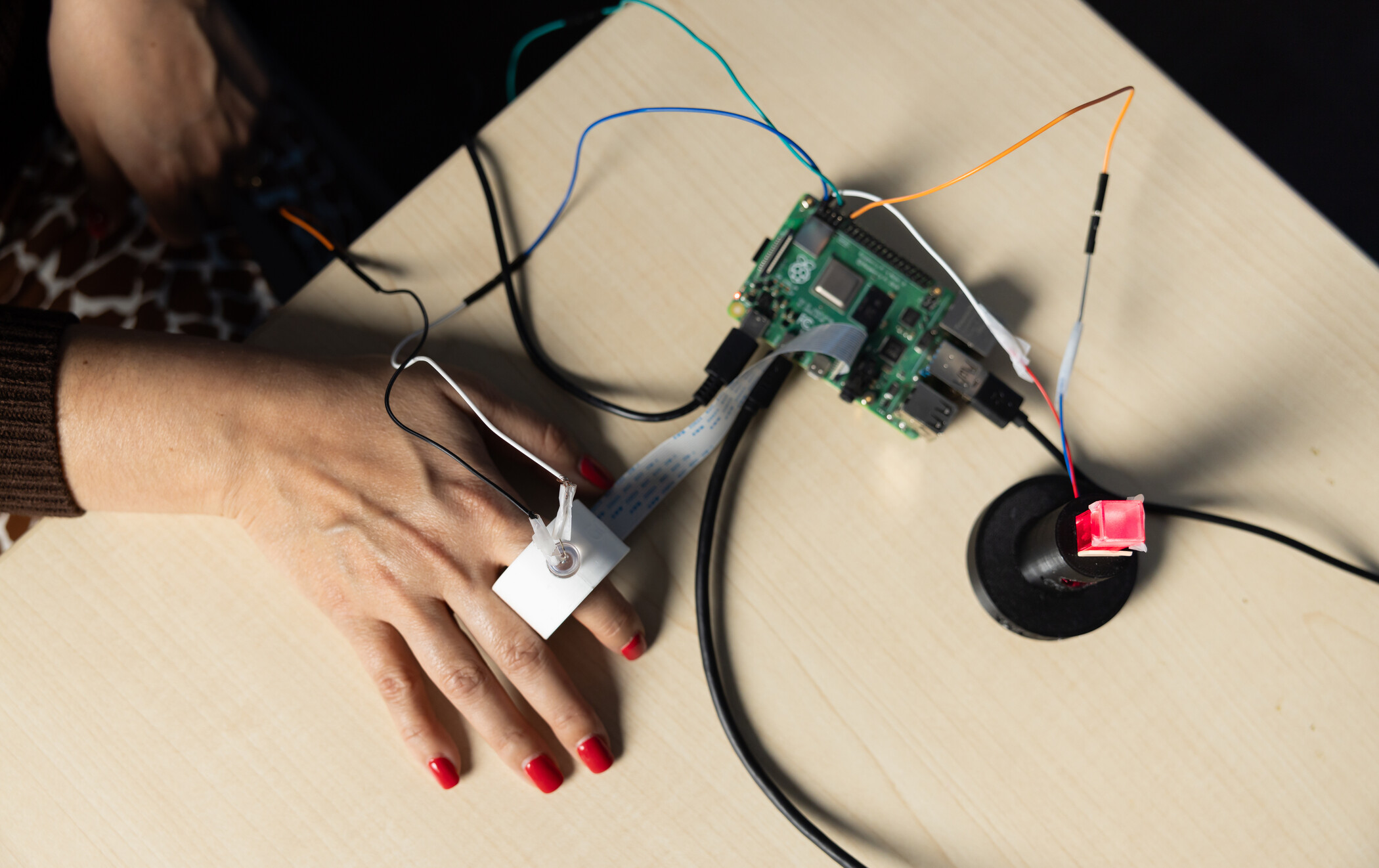 close up of hand using robotic machine