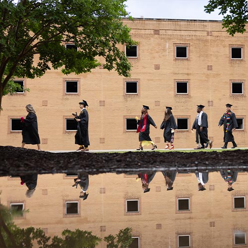 KSU graduate students walking on campus.