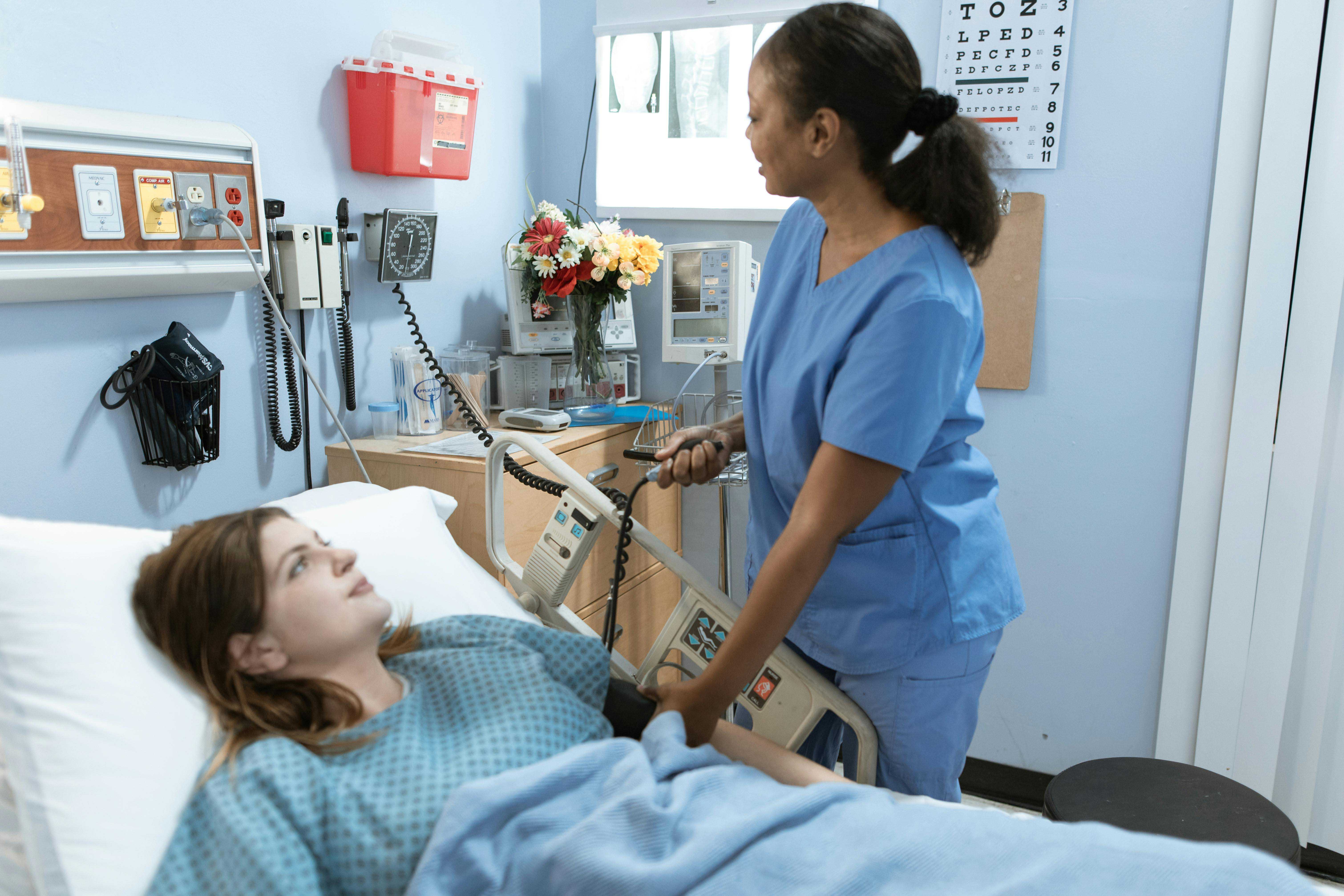 female nurse in hospital attending to patient
