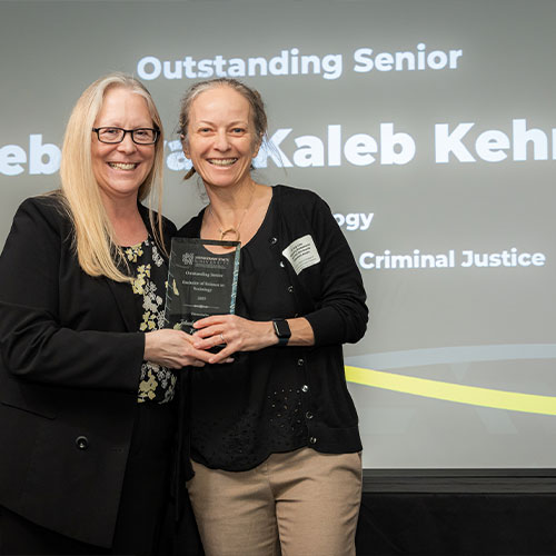 criminal justice outstanding senior smiling for picture.