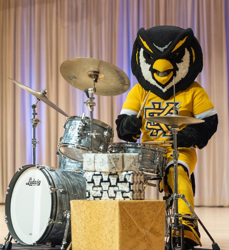 Scrappy playing drums