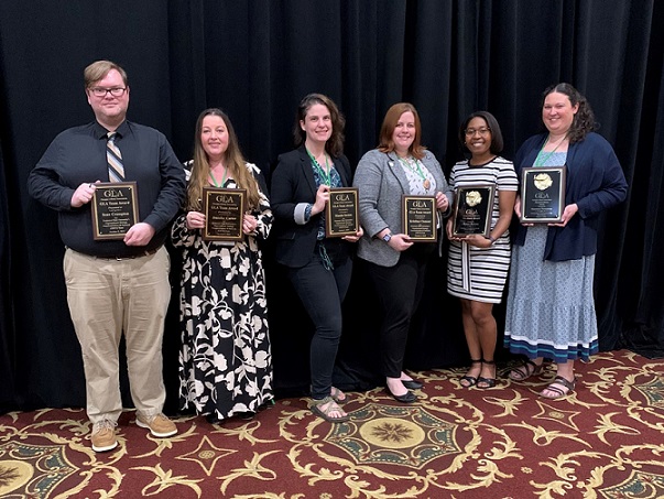 Sean Crampton, Jennifer Carter, Manda Sexton, Kristina Clement, Chelsee Dickson, Rosemary Humphrey holding GLA awards.