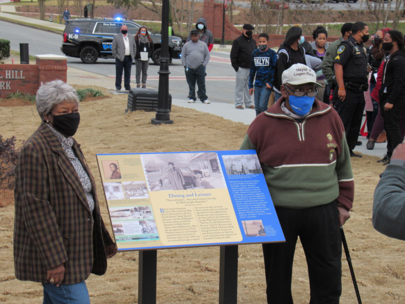 Willie Mae and Claude Johnson are shown next to an exhibit panel during the Doyal Hill Park opening, December 3, 2020