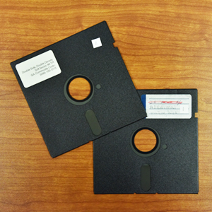 two floppy disk sitting on table
