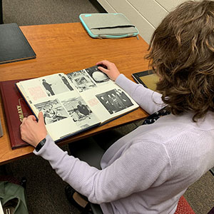 woman looking at archived ksu documents