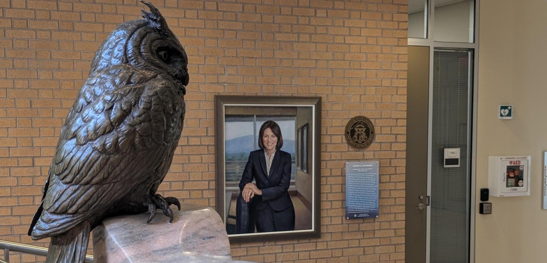 President Schwaig's portrait hanging on display