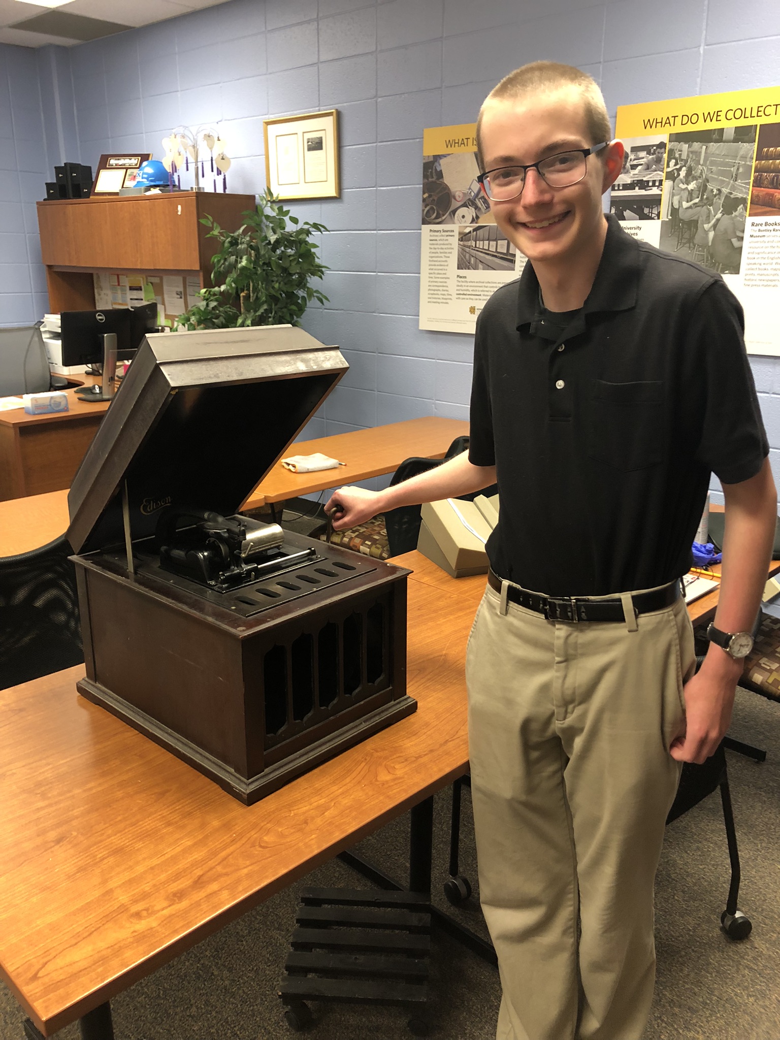 Student historian Andrew Bramlett with the Bentley Rare Book Museum's Amberola phonograph