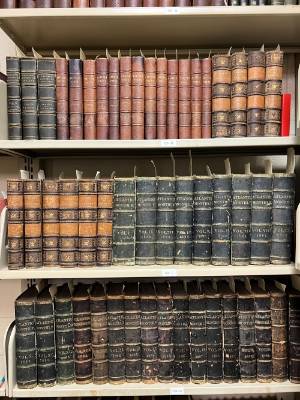 Many old books on a shelf in the rare book museum collection