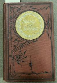 a brown bookshowing signs of age and minor damage. Orange Blossoms, Fresh and Faded, 1871, courtesy of the KSU Rare Book Museum.