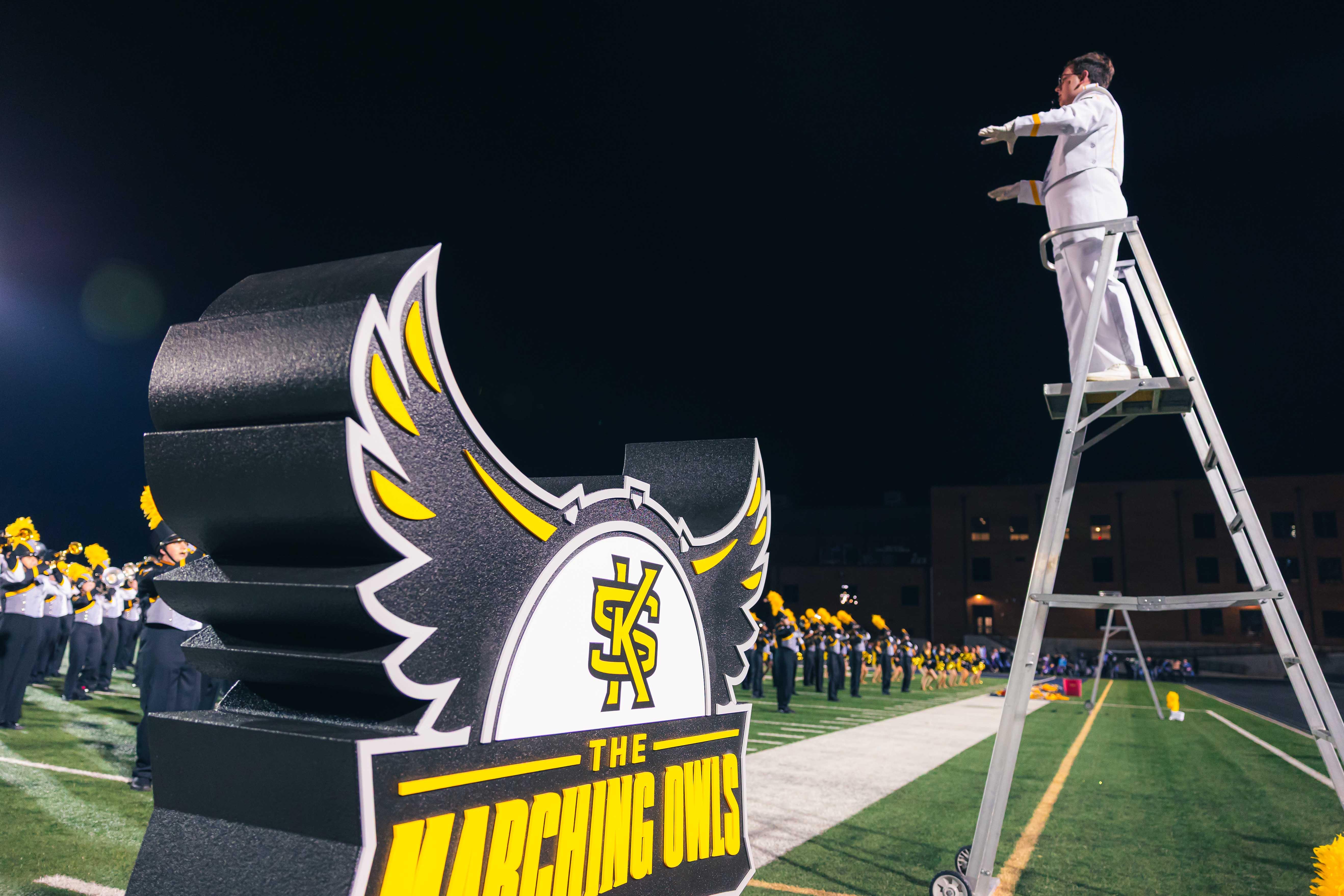 KSU's 2026 Marching Band / Pictures of KSU's marching band in uniform playing at a game with school spirit.