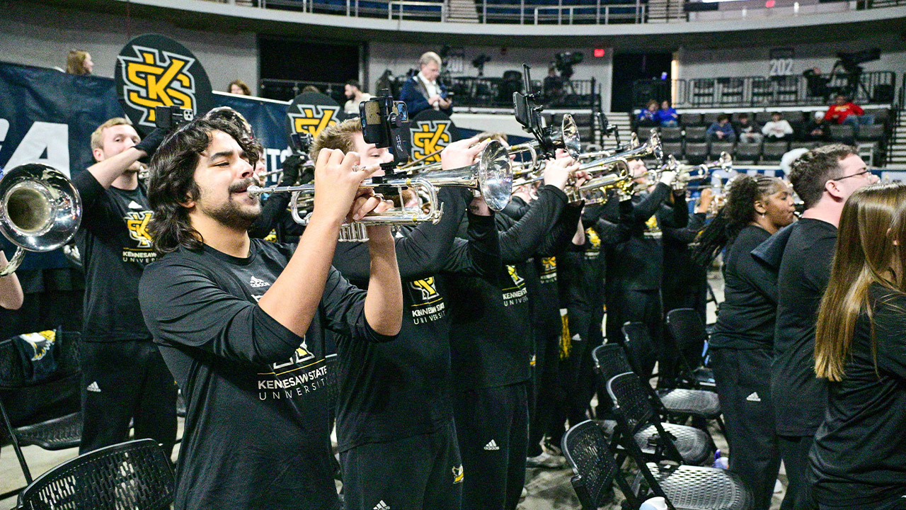 group of ksu band students playing at a game
