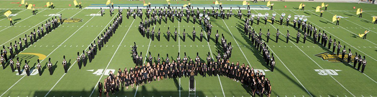 band members form a shape of the letters u s a 