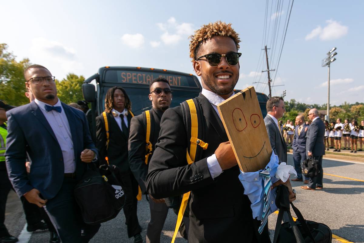 Kennesaw State University senior wide receiver Tanner Jones walks with Turnover Plank during Owl Walk before their game against Reinhardt Saturday, September 28, 2019