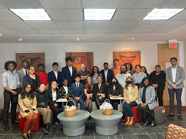 The 2021-22 SDG Futures Fellowship cohort smiling in a room.