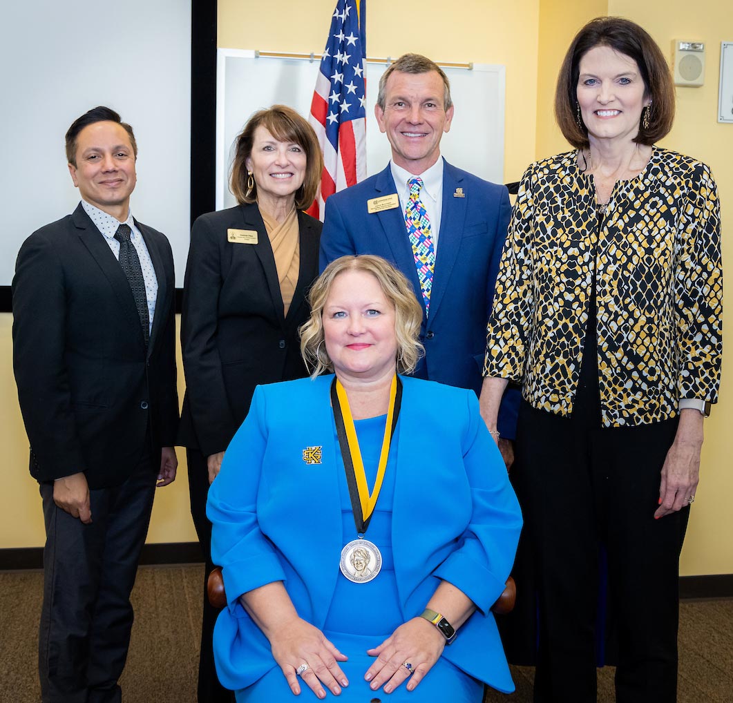 Standing L to R: Ivan Pulinkala, Debbie Pike, Lance Burchett, Kathy Schwaig; Sitting: Monica Swahn