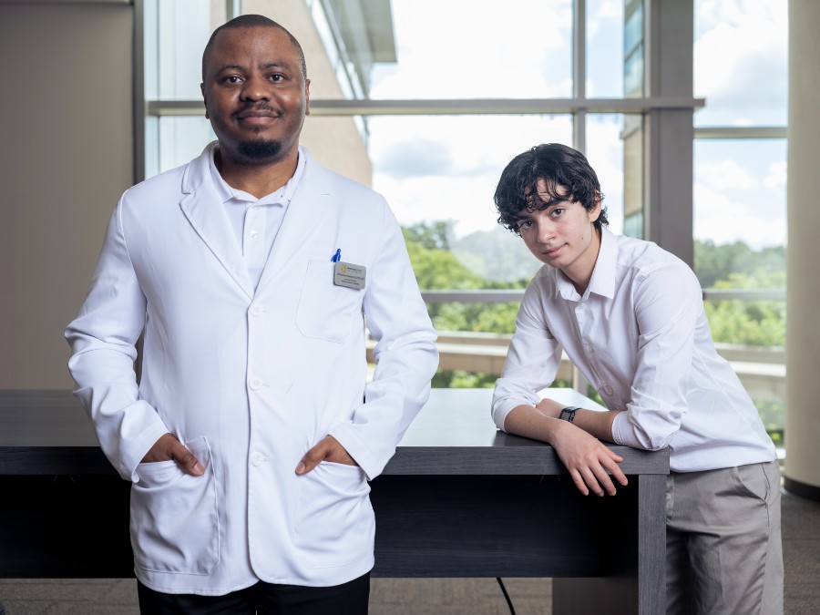 Nursing professor Chinomso Nwozichi, left, and student researcher Isaac Kuhn.