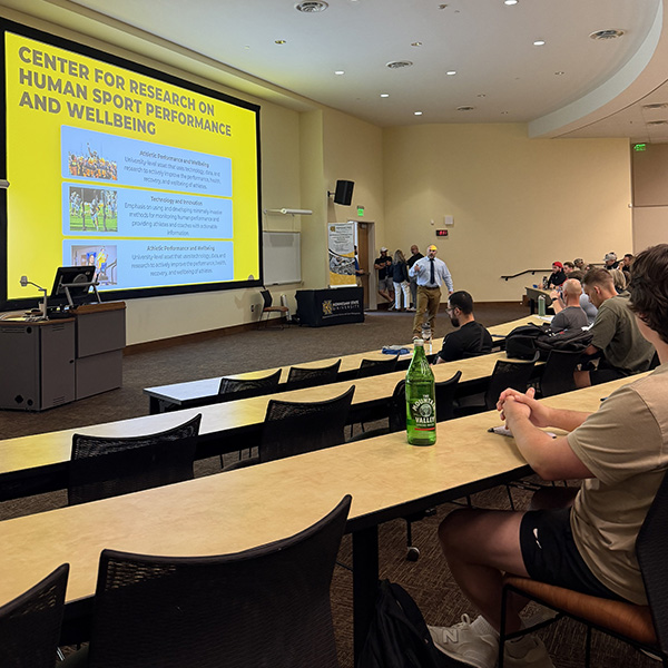 Class of students viewing a presentation on center for research on Human sport performance and wellbeing