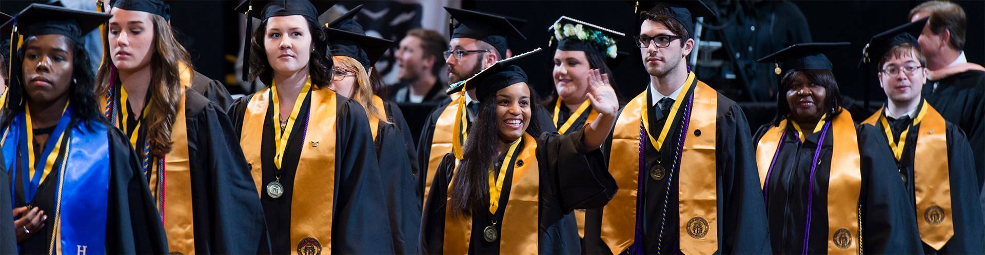 ksu students in cap and gown at commencement