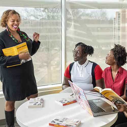 group of ksu students collaborating at a table.